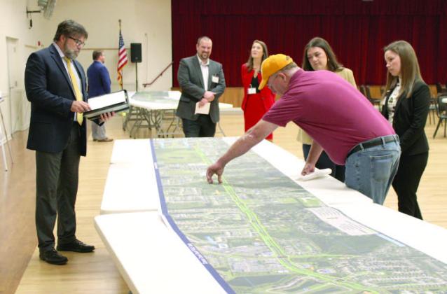 Residents meet with county transportation officials at a July 19 public forum for input on widening and improvements to Canoe Creek Road, including an upgraded intersections at Old Canoe Creek Road and Nolte Road. PHOTO/TERRY LLOYD