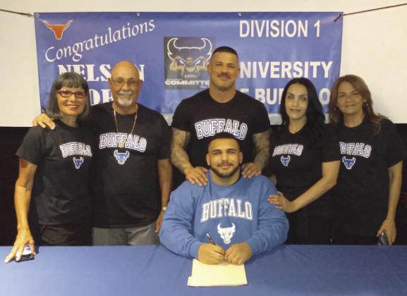 Harmony High wrestlers Nelson Toro, who signed this week, and Rey Ortiz, are on to the college level after singing with the University of Buffalo and Presbyterian College respectively. PHOTO/HARMONY HIGH
