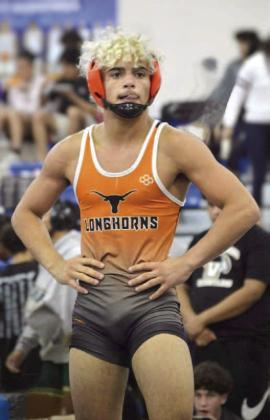 Harmony High wrestlers Nelson Toro, who signed this week, and Rey Ortiz, are on to the college level after singing with the University of Buffalo and Presbyterian College respectively. PHOTO/HARMONY HIGH