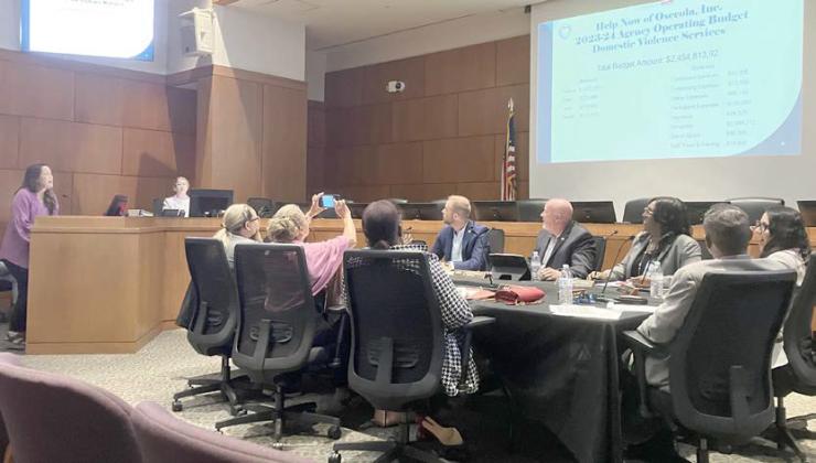 Hope Now of Osceola Executive Director Tammy Douglass briefs Kissimmee commissioners and city staff on efforts to assist the community thus far this year. PHOTO/TERRY LLOYD