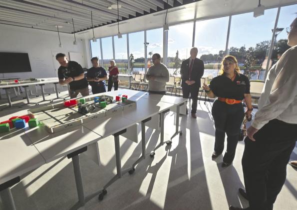 Osceola County Commissioner Viviana Janer shows off the robotics lab at the Osceola Tech Library, which opened on Friday. (Photo/Ken Jackson) For more photos, visit aroundosceola.com.