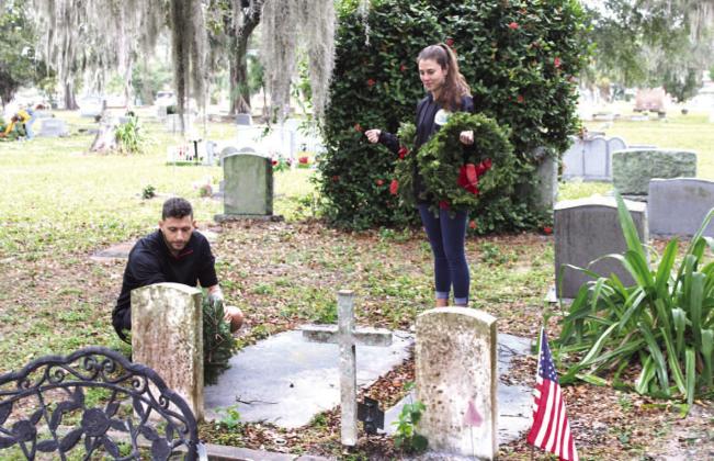 Participants braved the wet, windy weather Saturday at Rose Hill Cemetery to honor the hundreds of veterans interred there for Wreaths Across America. PHOTO/TERRY LLOYD