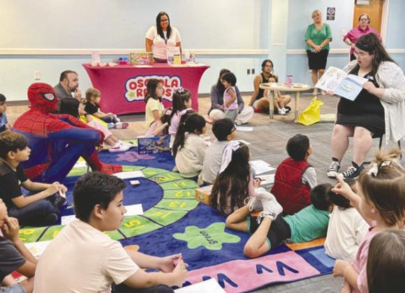 Local children enjoyed book readings, giveaways, games, and meeting an alligator at Early Learning Coalition’s launch of their new “Read to Rise” program at Hart Memorial Library on Friday. (Photos/Debbie Daniel)
