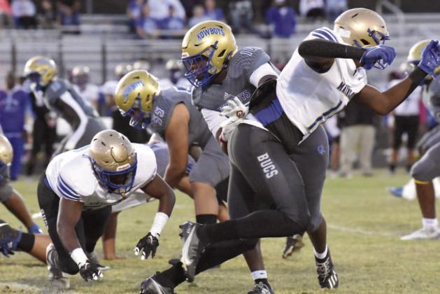 Led by defensive linemen Derrick LeBlanc (10) and John Walker (55), the Osceola defense has not allowed a point in the first three quarters of another its last four games. PHOTO/JANA STULTZ