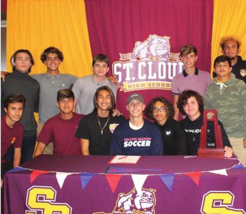 St. Cloud Senior Goaltender Noah Craig (front row, center) is surrounded by his teammates as he signs his letter of intent to play soccer at Francis Marion SUBMITTED PHOTO