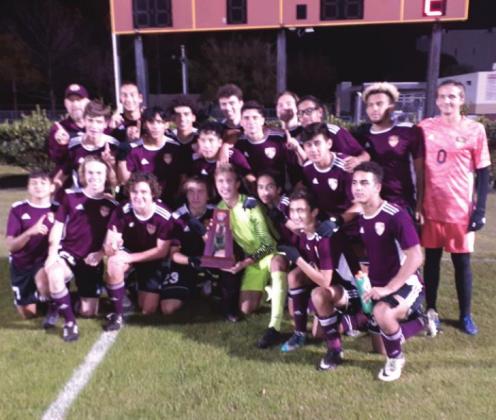 The St. Cloud High School boys team celebrate its first district soccer championship since 2004. NEWS-GAZETTE PHOTO/ J. DANIEL PEARSON