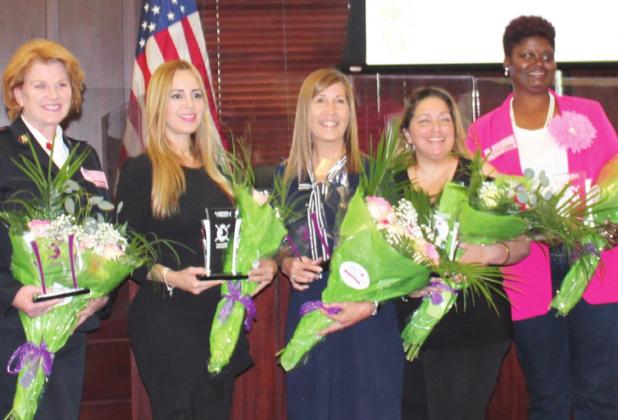 Osceola County honored its Woman Warriors Monday. From left: Cpt. Jessie Chapman, Bethzaida Garcia, Wilda Belisle, Diana Marrero-Pinto and Jennifer Paul. PHOTO/KEN JACKSON