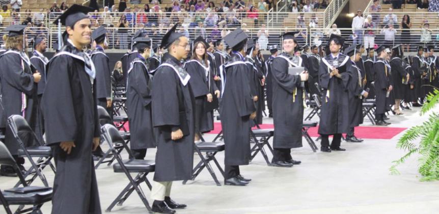 NeoCity Academy’s inaugural graduates receive applause from family and friends near the end of Friday’s commencement at the Silver Spurs Arena. PHOTO/KEN JACKSON