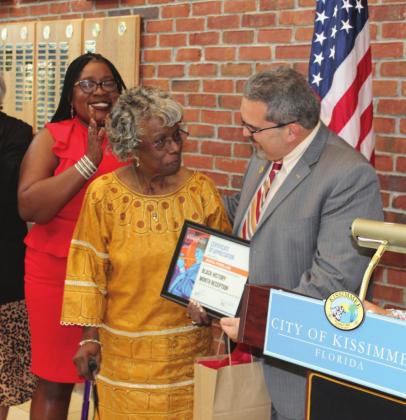 Community leader Anna Pinellas received a certificate of appreciation form Kissimmee Mayor Jose Alvarez.