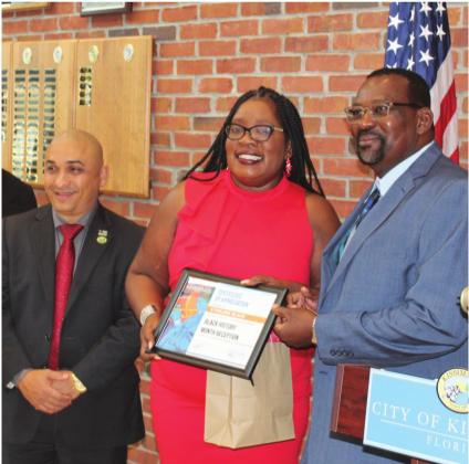 Pastor Sterling Blake received a certificate of appreciation from City Commissioner Angela Eady. News-Gazette photos by Brian McBride