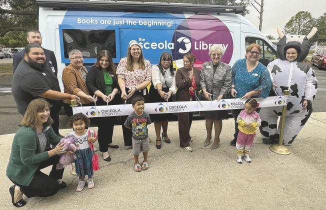 County and library officials cut the ribbon Tuesday on OLLie—the new Osceola Library Link van, fully equipped to serve as a Library on the Move to places not near existing libraries. (Photo/David Chivers)