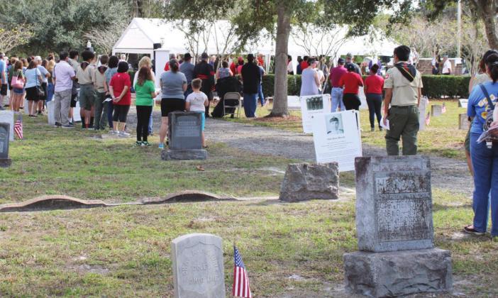 At noon, a patriotic ceremony began to remember the fallen veterans, including over 300 Union veterans from the Civil War, interred at the cemetery.