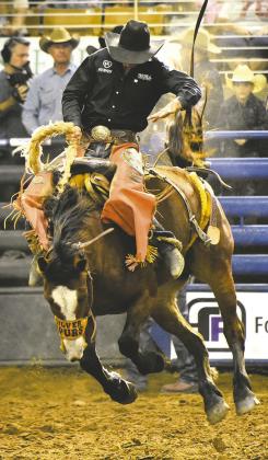 Home game: Local saddle bronc rider Parker Kempfer went for a ride on the Silver Spurs Riding Club’s Bobbi Sue in Sunday’s Silver Spurs Rodeo performance (Photo/Katie Williams).