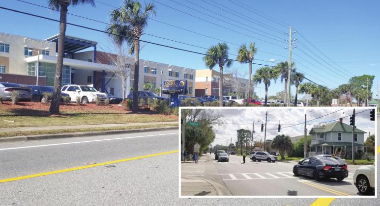 All is quiet outside Osceola High School Monday, a far cry from Friday’s lockdown, which closed Thacker Avenue for a time (inset). PHOTOS/KEN JACKSON