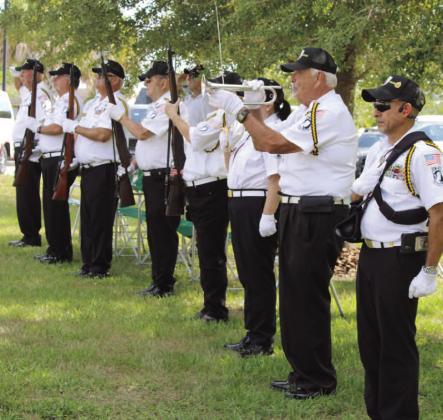 Osceola County Veterans Council renders a 21-gun salute and plays taps. PHOTOS/TERRY LLOYD