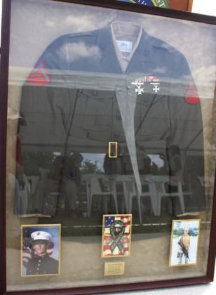 The uniform of Marine Lance Corporal Jason Burnett who was killed in action on May 5, 2006, in Operation Iraqi Freedom. PHOTOS/TERRY LLOYD