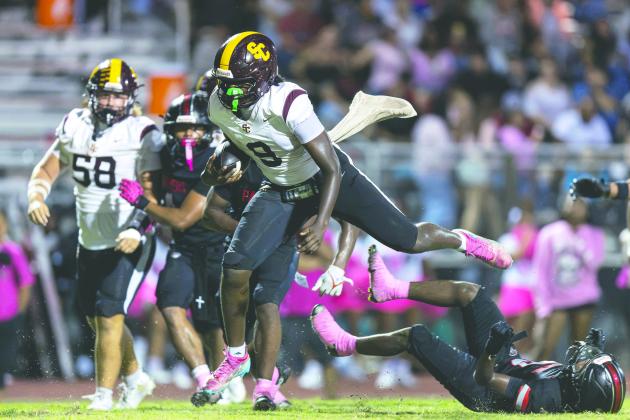 The St. Cloud Bulldogs and quarterback Jeremiah Lattier hope to keep the team’s playoff hopes alive Friday when they host Windermere; it’s one of seven games being played in the county in Week 8. (Photo/Taylor McFee)