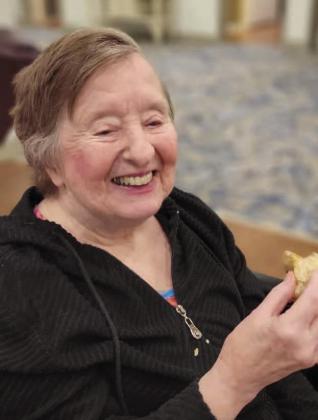 A Glades Retirement Home resident enjoys Gourmet Bites hors d’oeuvres-like servings, which eliminates the utensils that can be hard for some elderly to use. SUBMITTED PHOTO