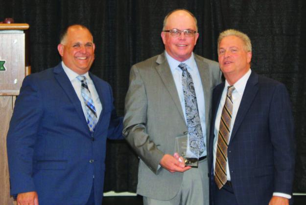 Robert Bass (center) was named Chamber Business Person of the Year. PHOTOS/KEN JACKSON