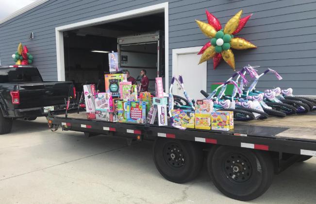 Donated toys are brought in to Shamrock Autobody for the Drive-thru Toy Drive on Nov. 14. SUBMITTED PHOTO