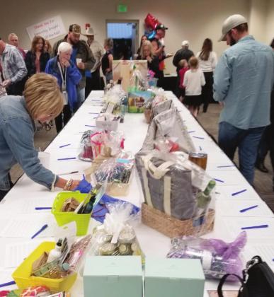 A silent auction to benefit the family of a local 4-H member killed in a auto accident opened Friday and will run through the end of the Osceola County Fair inside the KVLS office. PHOTO/KEN JACKSON