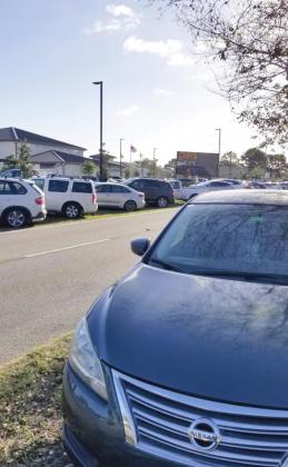 Cars fill the parking lot of 65th Infantry Park — and the median and sides of Buenaventura Boulevard. PHOTOS/KEN JACKSON