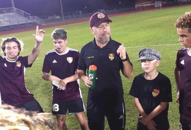 St. Cloud Head Coach Weylan Craig (center) talks to his team following Wednesday 3-0 win over Viera. news-gazette Photo/j. daniel Pearson