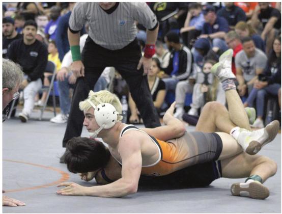 Harmony’s J.C. McNichols (top) pins Freedom’s Eric Aja Saturday to win the Region 3A-3 championship Saturday. He’ll vie for the 138-pound Class 3A championship this weekend at the Silver Spurs Arena. SUBMITTED PHOTO