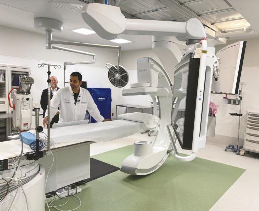 Orlando Health interventional cardiologist Dr. Prakrut Patel demonstrates the advanced technology used in the new cardiac catheterization lab opening at St. Cloud Hospital (Photo/Terry Lloyd)
