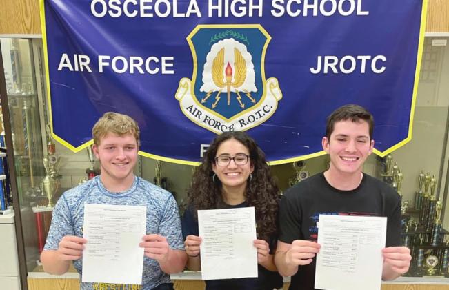 From left, Cadet Col. Donovan Bohannon, Cadet Col. Giselle Rivera-Lopez, and Cadet Col. Jacob Carter display their outstanding Leadership and Management certification scores. PHOTO/OSCEOLA HIGH SCHOOL
