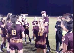 SUBMITTED PHOTO St. Cloud Head Coach Sean Beck talks to his team during a timeout of the Lady Bulldogs 12-0 win over Liberty in the opening round of the Orange Belt Conference Tournament.