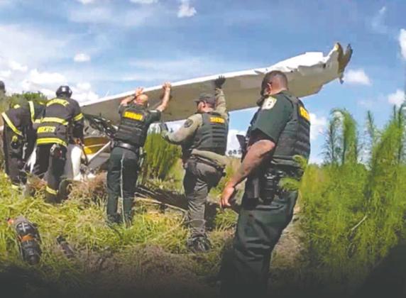 Police officers and firefighters responded to a plane that crashed on Saturday afternoon just west of John Young Parkway south of downtown Kissimmee. The pilot and a passenger were injured and taken to a local hospital. For details on the crash, visit aroundosceola.com. (Photo/Osceola County Sheriff’s Office)