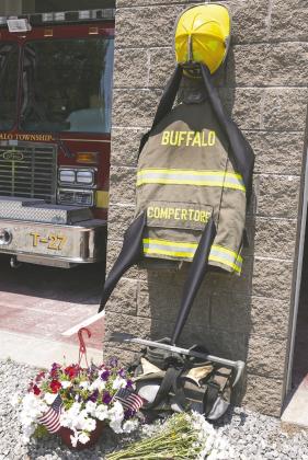Flowers and a tribute to fallen firefighter Corey Comperatore are pictured at the Buffalo Township (Pa.) Volunteer Fire Monday. Comperatore was shot and killed at Saturday’s Donald Trump rally. AP PHOTO/SUE OGROCKI