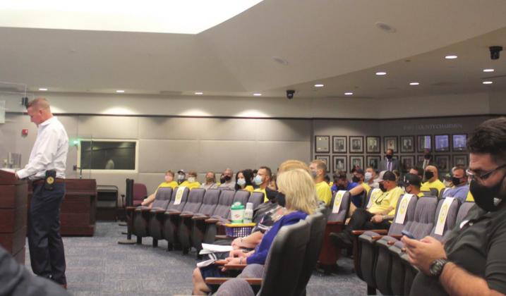 Osceola County Firefighters union President Adam Seithel speaks to the Osceola County Commission about its lack of a current contract. PHOTO/KEN JACKSON