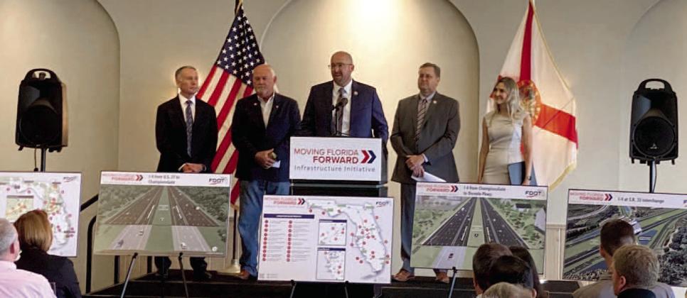 Osceola County Manager Don Fisher (left) with Florida Department of Transportation Secretary Jared Perdue (center) at the Interstate 4 project announcement. PHOTOS/FDOT