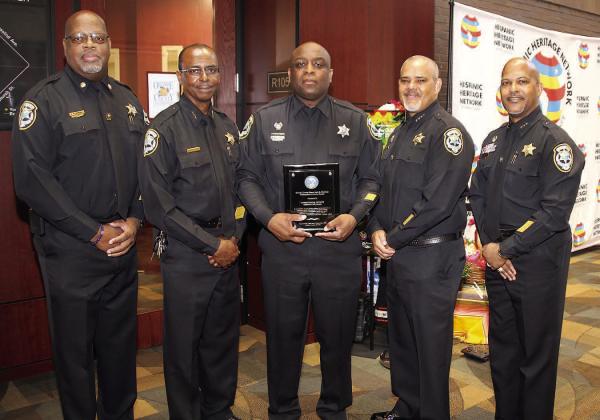 Orange County Corrections Officer Timothy Williams of Kissimmee, pictured with his Corrections brethren, was honored last week for his efforts to help thwart a 2023 potential kidnapping. PHOTO/ORANGE COUNTY CORRECTIONS
