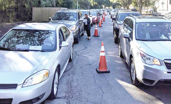 Two lines of cars stretch across the campus of the Florida Department of Health – Osceola on Monday, as individuals who registered for the COVID-19 vaccine wait to get the injection. PHOTO/FLORIDA DEPARTMENT OF HEALTH - OSCEOLA