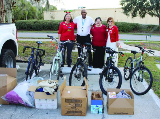 Transition House Counselor Larry Henry Accepts Donations from the Joshua Stevens Chapter of the Daughters of the American Revolution. PHOTO/TERRY LLOYD
