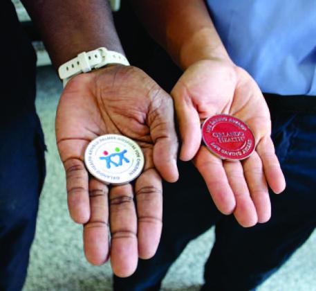 The 'challenge coins' KFD paramedics received from Arnold Palmer Hospital for Children. PHOTO/KEN JACKSON