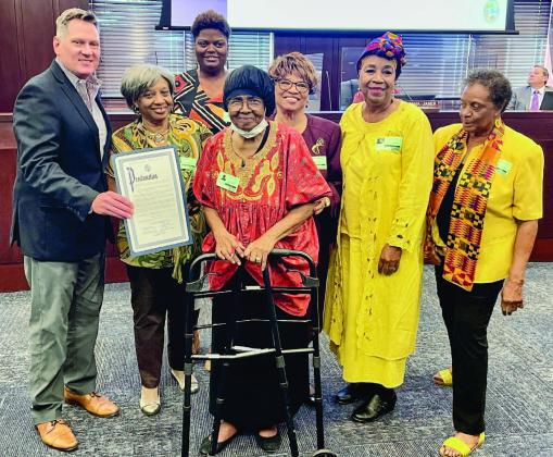 Commissioner Brandon Arrington presents a Black History Month proclamation Monday to members of Osceola County’s African-American community. PHOTO/OSCEOLA COUNTY