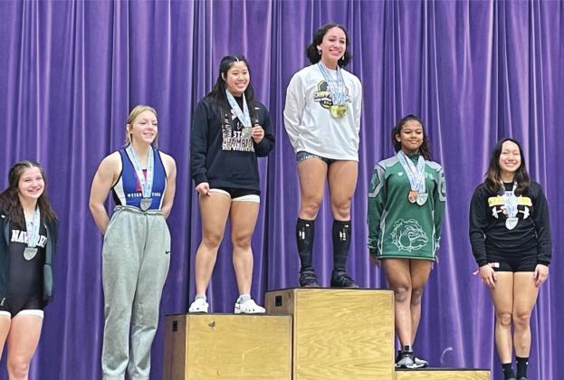 Harmony’s Adriana Rosa (top pedestal) rose to the top of the state at the Class 3A state weightlifting meet with a 350-pound combined effort inthe 139-pound weight class. SUBMITTED PHOTO