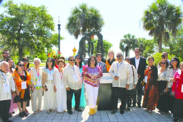 Kissimmee Mayor Jackie Espinosa with members of the Bataan-Corregidor Memorial Foundation board and Filipino-American community at Saturday’s Filipino-American Friendship Day. PHOTO/TERRY LLOYD