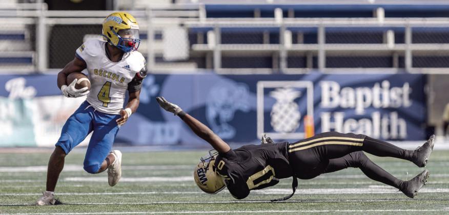 Osceola running back Taevion Swint hopes to make college defenders miss at UCF like he did on this play in the Class 6A state title game against West Boca Raton. PHOTO/TAYLOR MCFEE