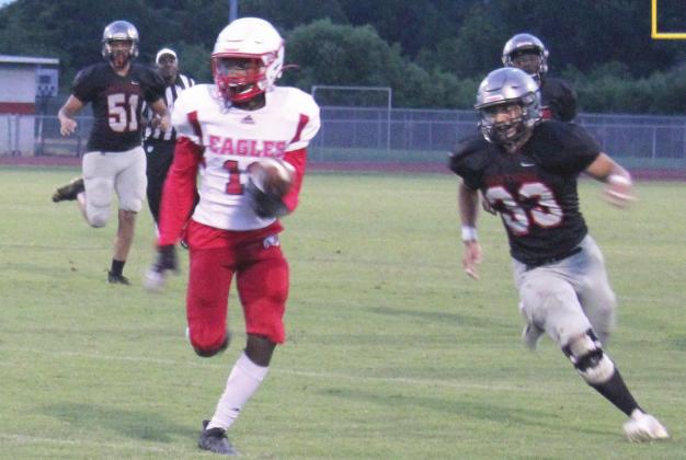 Poinciana’s Earnest Nunn runs for a gain in last week’s spring game against Gateway. The Eagles won, 20-6. PHOTO/KEN JACKSON