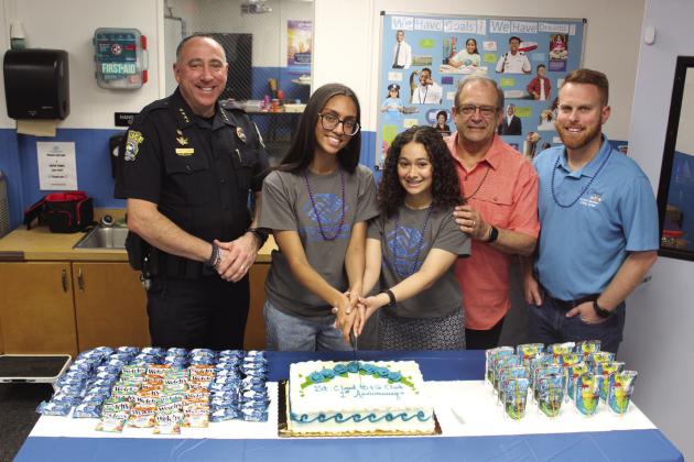 From left, St. Cloud Police Chief Doug Goerke (a Friday staple at the club), leaders-intraning E. Pujols and A. Marcano, St. Cloud Mayor Nathan Blackwell and Councilman Kolby Urban helped celebrate the city’s Boys &amp;amp; Girls Club’s one-year anniversary Friday. PHOTO/KEN JACKSON