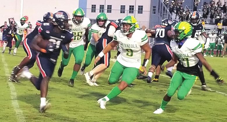 Tohopekaliga running back Ken Chery runs the ball in Friday’s game against Lake Minneola. PHOTO KEN JACKSON
