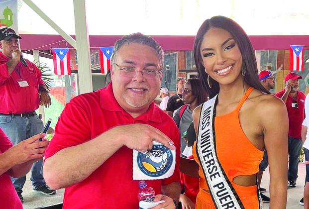 Miss Puerto Rico Ashley Ann Barreto Carino with Osceola Clerk of Court Kelvin Soto. PHOTO/CHRIS MILLER