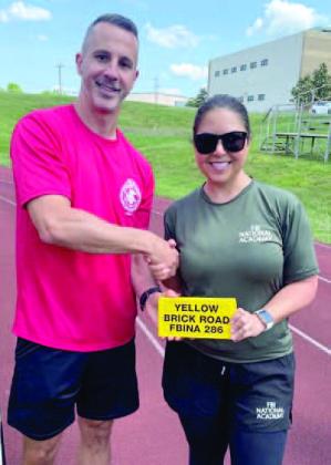 St. Cloud Police Capt. Denise Roberts receives her “yellow brick” for completing physical training at the FBI National Academy. SUBMITTED PHOTO
