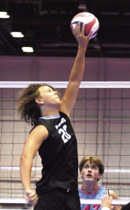 Middle blocker Gavin Williams makes a key play during the tournament.  PHOTOS/KATIE WILLIAMS