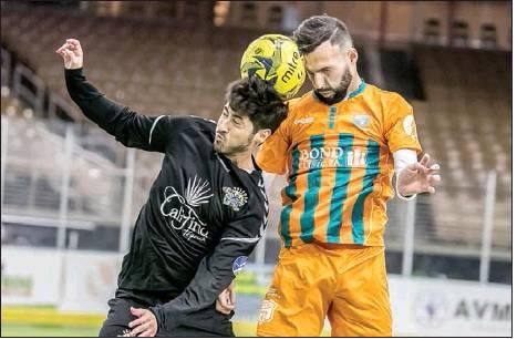 Photo courtesy of PhiliP Podskalan Orlando SeaWolves Midfielder Mario Alvarez (black uniform) advances the ball against a Florida Tropics defender.